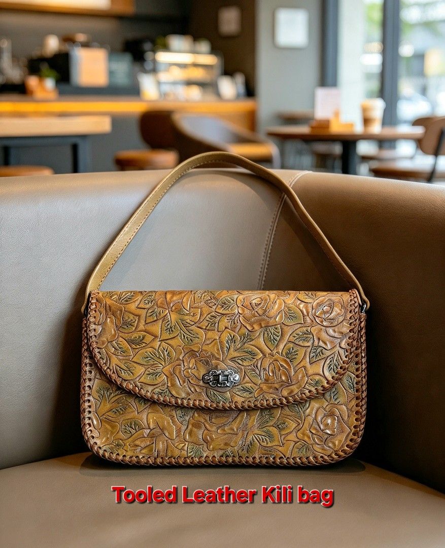 Vintage Tooled Leather Rose Floral Pattern Shoulder Bag (Category: Shoulder Bags) located in Davao. Submitted by wengbagstuff (Listing ID 1467347857, Image 1). Description: 🍀 tooled crafted leather bag 🍀 no damage, in very good condition 🍀 rare tooled kili bag 🍀 silver twisted lock.