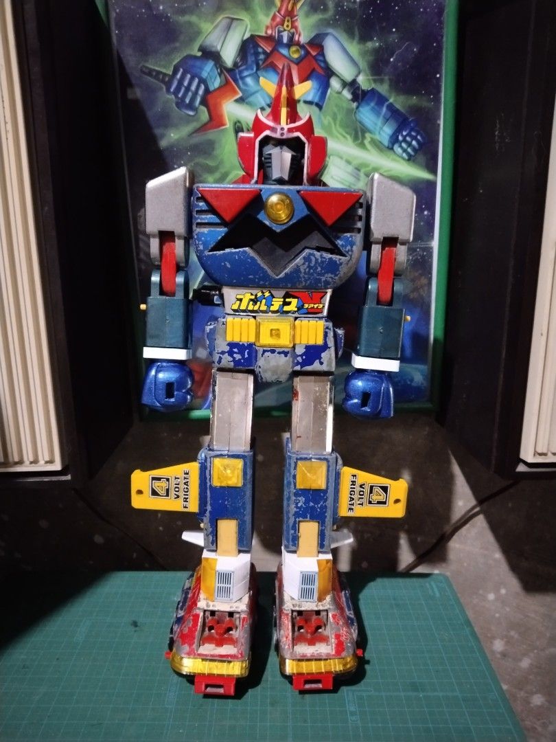 Vintage Voltes V Combiner Robot Toy (Category: Action & Battle Toys) located in Manila. Submitted by megazordbuilderhunter (Listing ID 1467257432, Image 1). Description: - Classic vintage Voltes V combining robot toy - Complete with all 5 component vehicles (Volt Cruiser, Bomber, Panzer, Frigate, Lander) issue some missing parts paint ship some 3d parts - Transforms fully into giant robot mode - Condition: Shows noticeable paint chips, scuffs, an