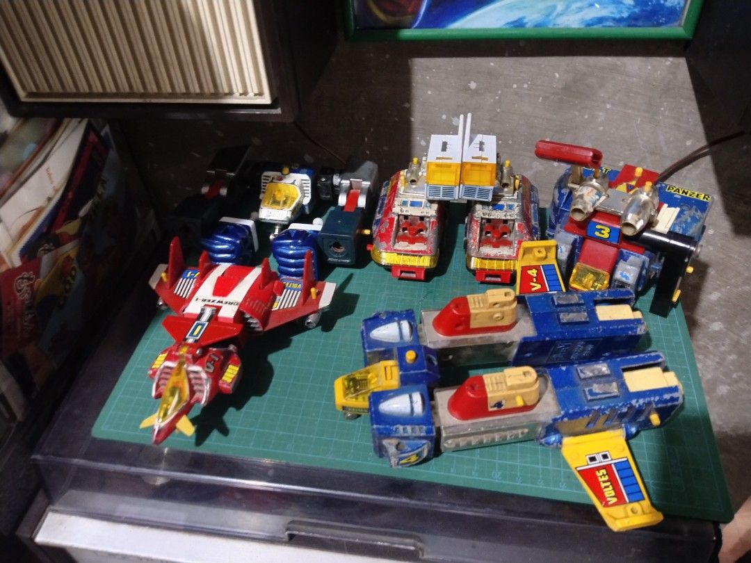 Vintage Voltes V Combiner Robot Toy (Category: Action & Battle Toys) located in Manila. Submitted by megazordbuilderhunter (Listing ID 1467257432, Image 2). Description: - Classic vintage Voltes V combining robot toy - Complete with all 5 component vehicles (Volt Cruiser, Bomber, Panzer, Frigate, Lander) issue some missing parts paint ship some 3d parts - Transforms fully into giant robot mode - Condition: Shows noticeable paint chips, scuffs, an