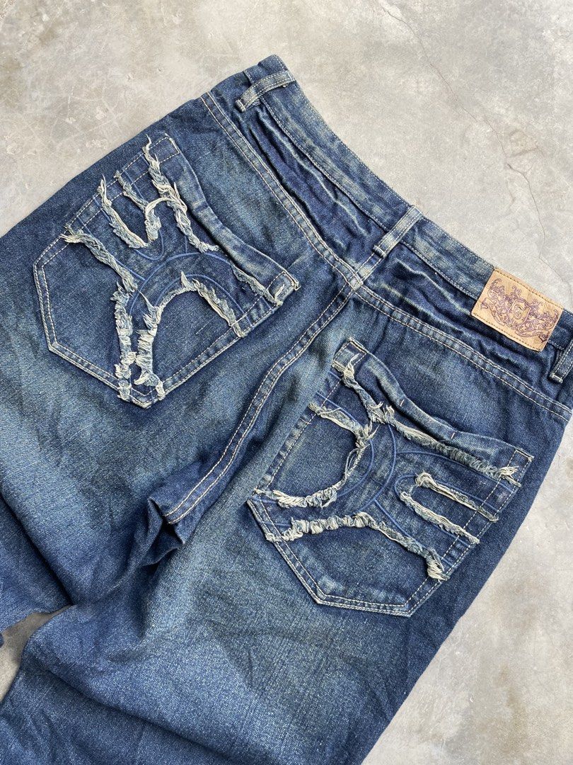 W:32 L:40 R:14 Hem:10 (Category: Jeans) located in Manila. Submitted by noble.daniel (Listing ID 1467261467, Image 3). Description: Dark blue denim jeans with heavy fading and whiskering on the front. Unique frayed distressing and stitching details on both back pockets. Classic five-pocket setup with belt loops. Straight leg fit, slight flare at the hems. Brand tag on the back waistband and inside front collar. Sturdy material with natural wear p