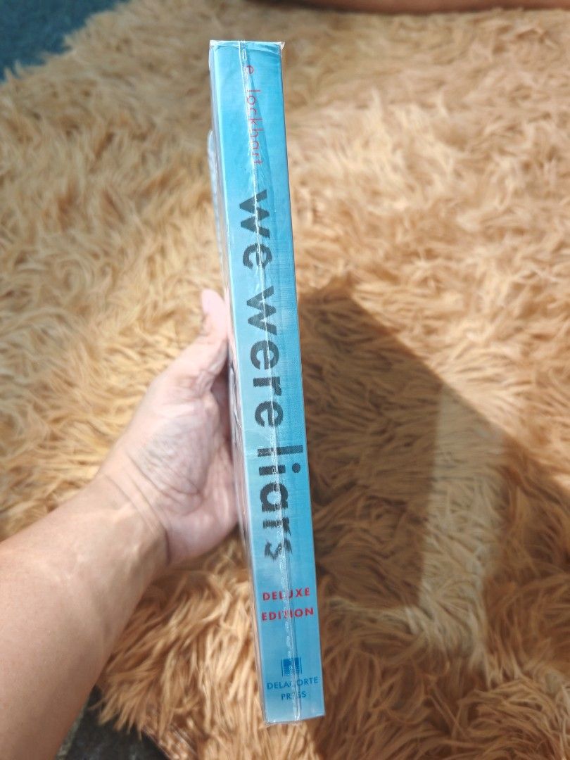 We Were Liars - Deluxe Edition (Category: Storybooks) located in Cebu City. Submitted by mira.bless (Listing ID 1467176328, Image 3). Description: Pre-loved book Authentic copy Deluxe edition We Were Liars - E. Lockhart Cadence Sinclair Eastman is trying to piece together the events of a summer two years prior that she cannot remember, involving four close-knit friends known as the "Liars," a dark accident, a family revolution, and buried secrets