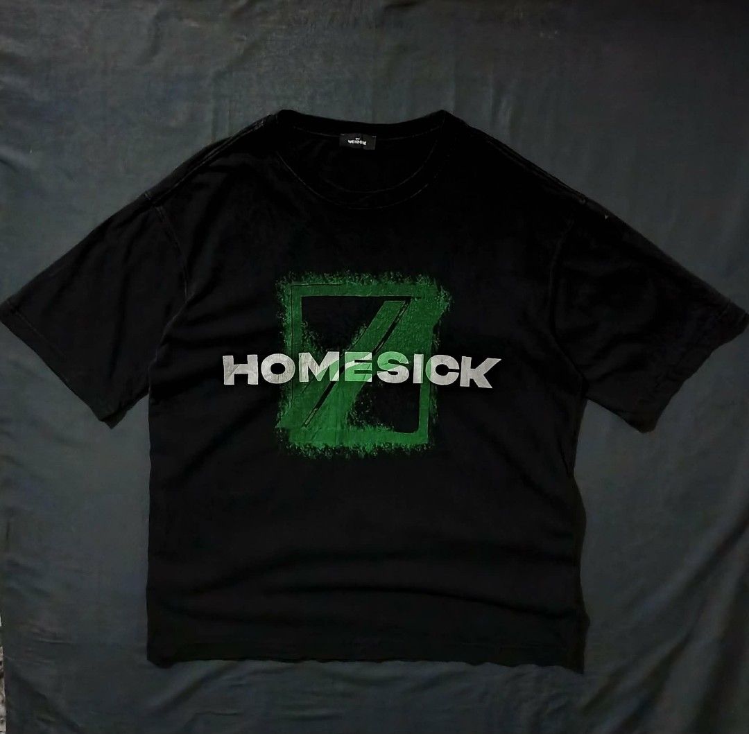 Welldone Homesick Black T-Shirt (Category: Tshirts & Polo Shirts ) located in Manila. Submitted by oxthrift (Listing ID 1467320702, Image 1). Description: - Brand: WeError - Item: Black oversized t-shirt with green/white 'HOMESICK' chest graphic - Fit: Oversized - Material: Heavyweight cotton - Condition: Excellent, worn a few times, washed carefully, neck tag intact - Flaws: None (no stains, rips, or graphic fading).
