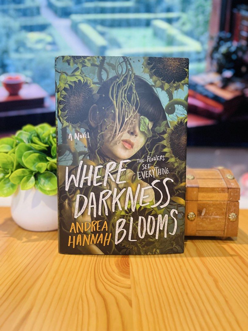 Where Darkness Blooms by Andrea Hannah (Category: Storybooks) located in Makati City. Submitted by pagesandplay (Listing ID 1467319396, Image 1). Description: - Title: Where Darkness Blooms by Andrea Hannah - Format: Hardcover YA thriller novel (Wednesday Books) - Condition: Clean pages, read once, carefully stored on bookshelf - Features: Striking cover art with a girl tangled in sunflowers - Perfect for: Thriller and horror fans - To order: DM 