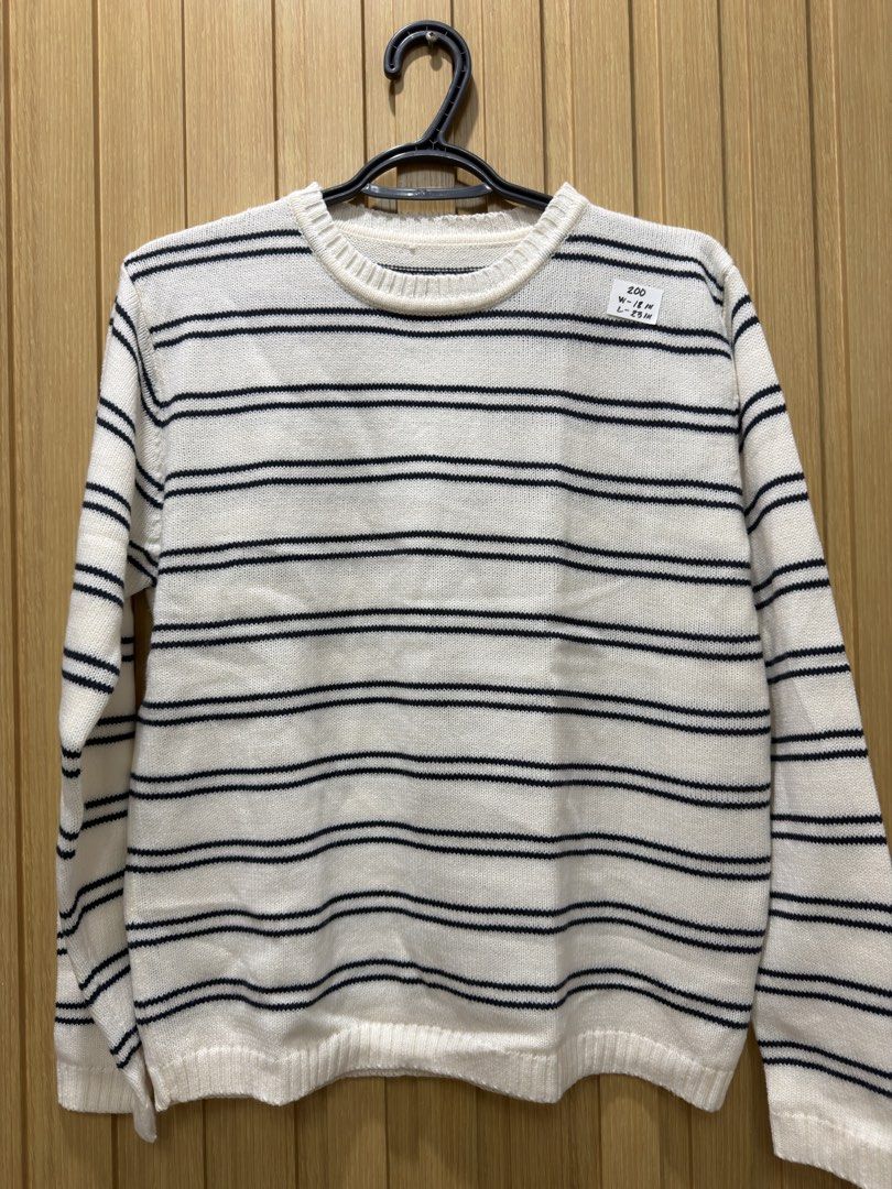 White and black striped knit sweater (Category: Longsleeves) located in Bacoor. Submitted by preloved_with_love_ (Listing ID 1467333634, Image 3). Description: - Color & Pattern: White with black horizontal stripes - Design: Crew neck with long sleeves, ribbed collar, cuffs, and hem - Styling: Classic and easy to match with jeans or skirts - Size/Measurements: Width 18 inches, Length 23 inches.