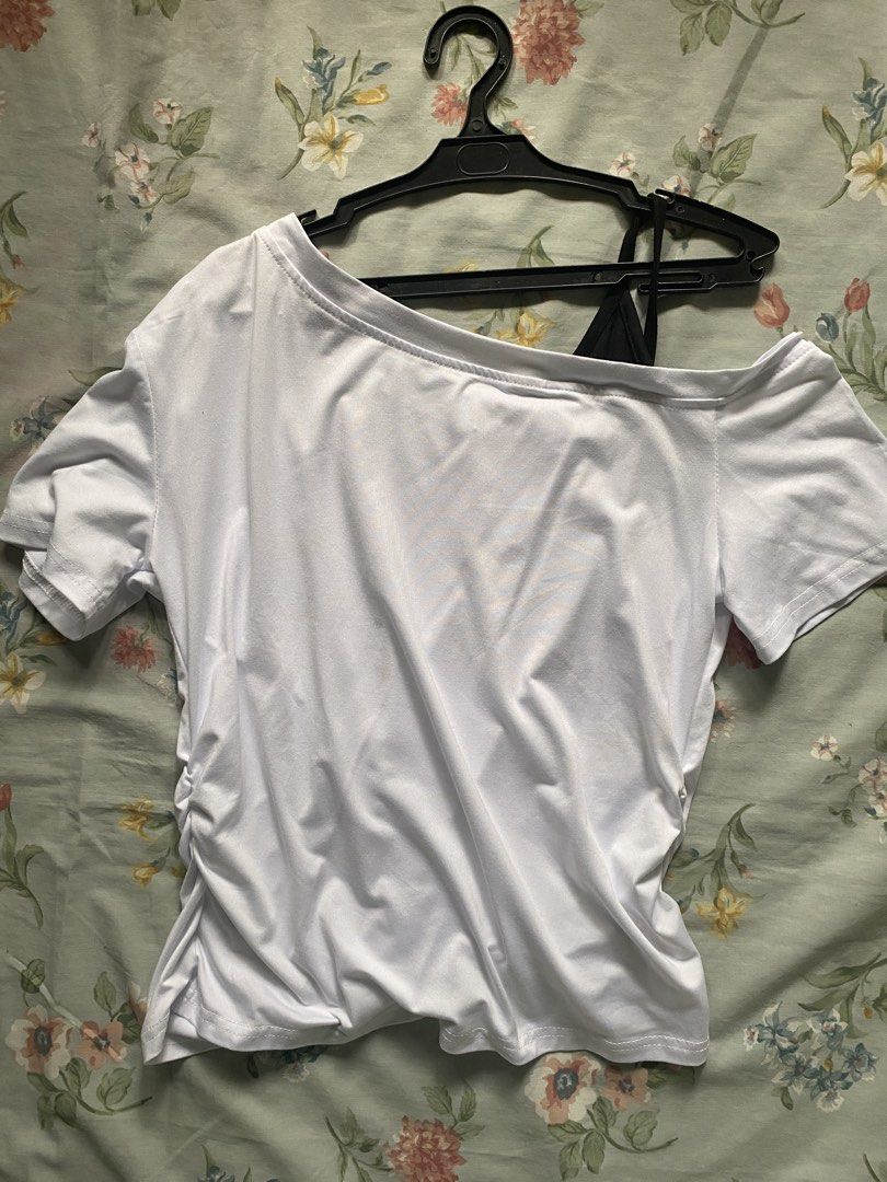 White Asymmetrical Top (Category: Others Tops) located in Manila. Submitted by danie_sells (Listing ID 1467240337, Image 1). Description: - Color: White with black camisole strap detail - Style: Asymmetric off-shoulder with ruched sides for a fitted look - Material: Soft and stretchy fabric - Condition: Never been used - Versatility: Easy to match with your favorite jeans or skirts ——— PAYO. Pay As You Order. 💵 MOP: Maribank 🚚 MOD: Lalamove or 