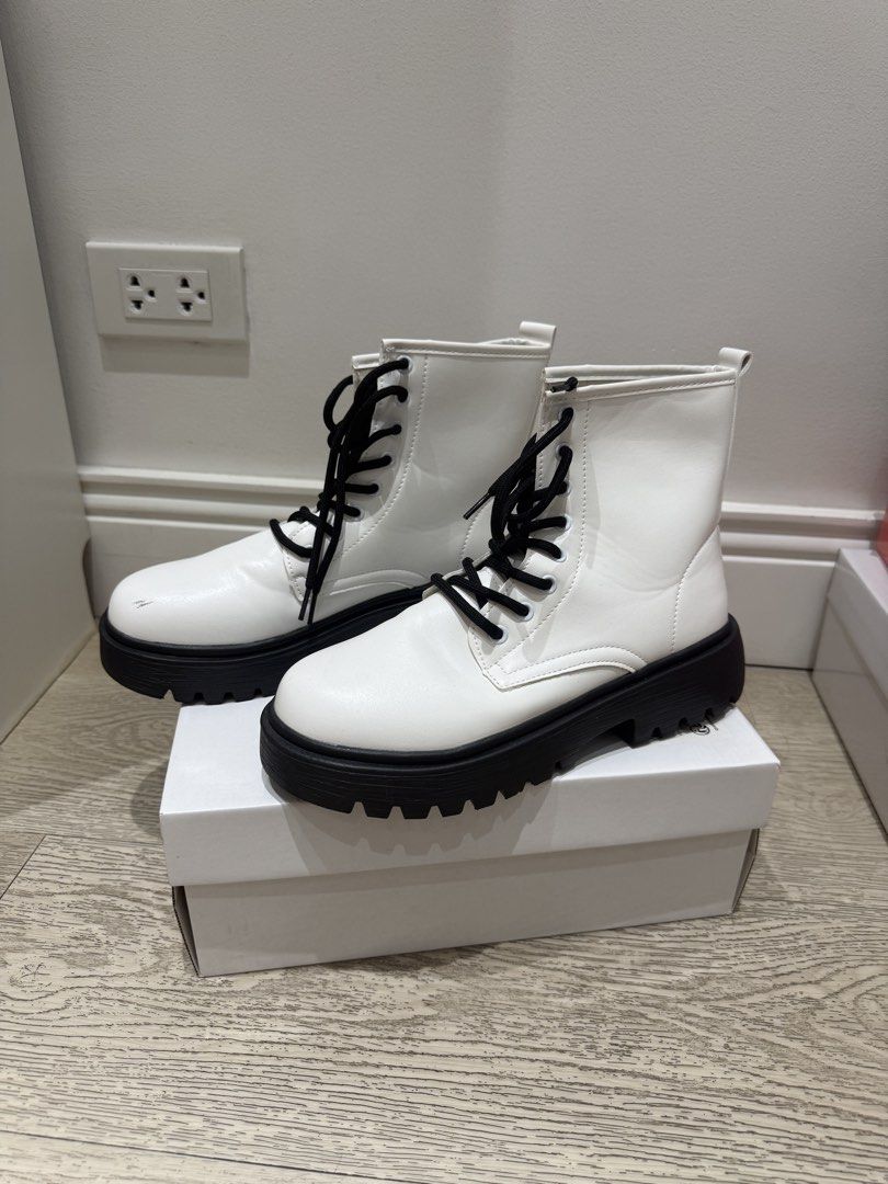 White Combat Boots with Black Platform Soles and Laces (Category: Boots) located in Quezon City. Submitted by anneyoung22 (Listing ID 1467256404, Image 1). Description: Lightly used Only used once for dancing Tiny scratches Location: QC.