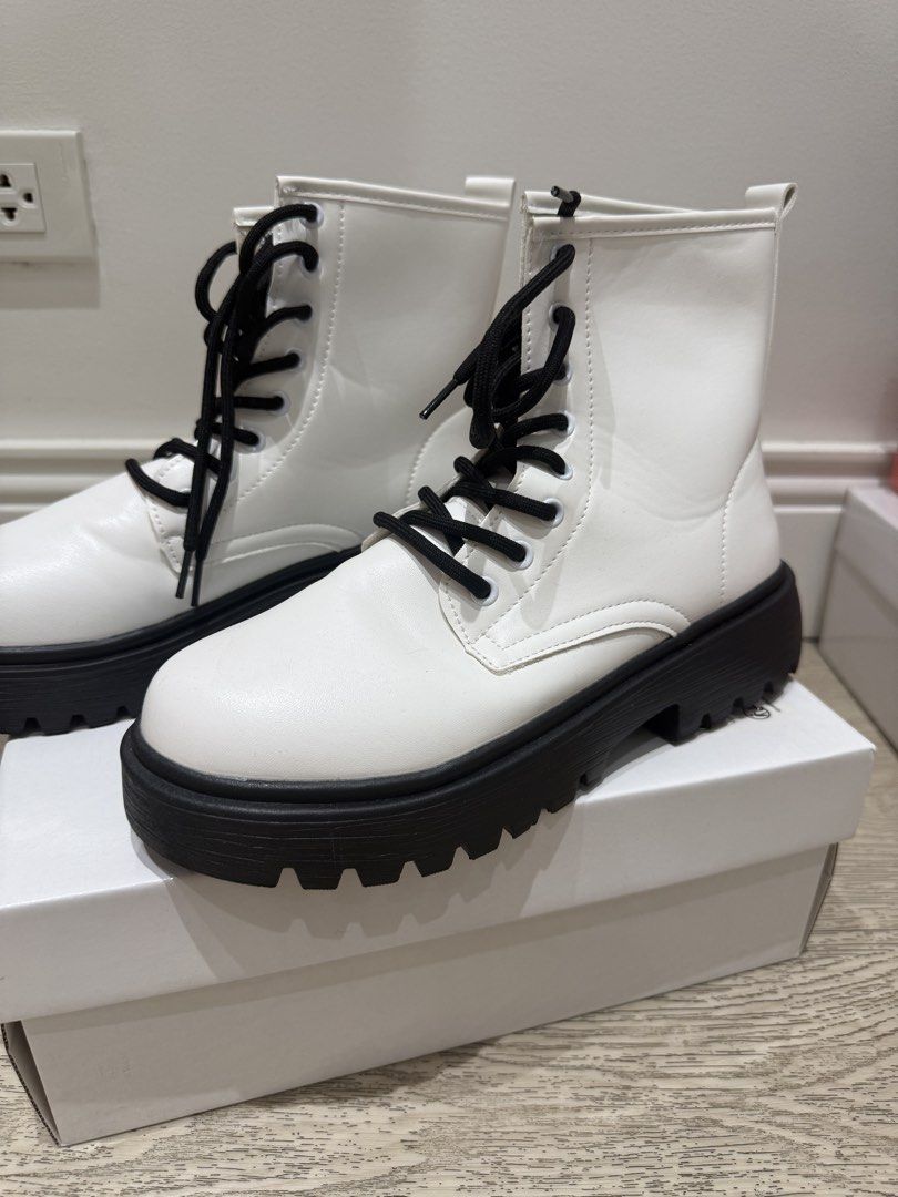 White Combat Boots with Black Platform Soles and Laces (Category: Boots) located in Quezon City. Submitted by anneyoung22 (Listing ID 1467256404, Image 2). Description: Lightly used Only used once for dancing Tiny scratches Location: QC.