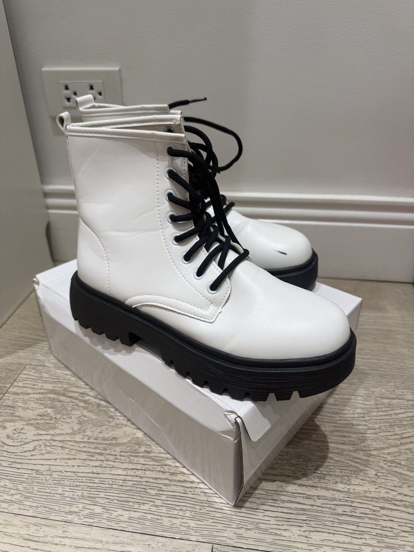 White Combat Boots with Black Platform Soles and Laces (Category: Boots) located in Quezon City. Submitted by anneyoung22 (Listing ID 1467256404, Image 3). Description: Lightly used Only used once for dancing Tiny scratches Location: QC.