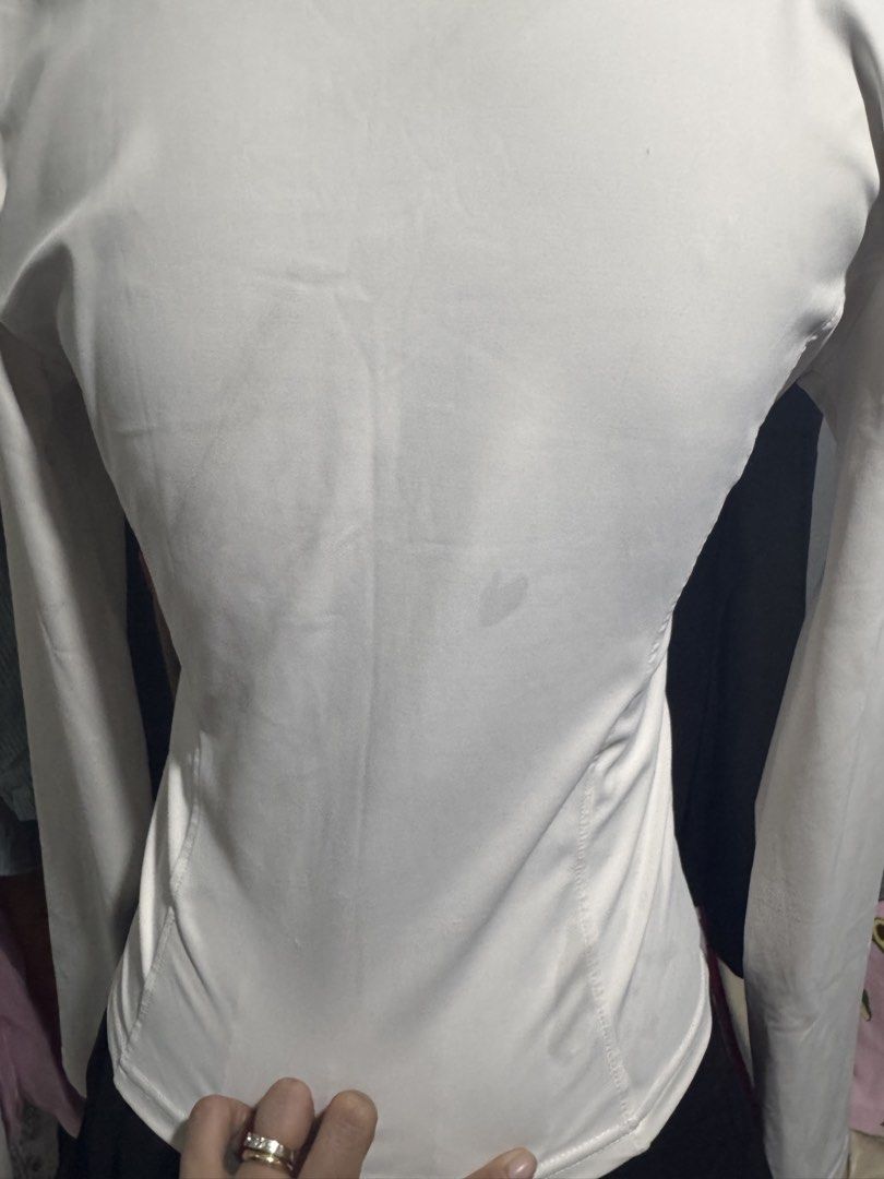 White Full Zip Athletic Jacket with Thumbholes (Category: Coats, Jackets and Outerwear) located in Manila. Submitted by sheinevida (Listing ID 1467265756, Image 3). Description: may mga stains hence selling low size medium to large pinangakyat ng bundok wearable pa din naman needs intensive wash po - Color: White - Style: Fitted athletic zip-up jacket with high collar and curved seam details - Features: Full front zipper and convenient thumbholes