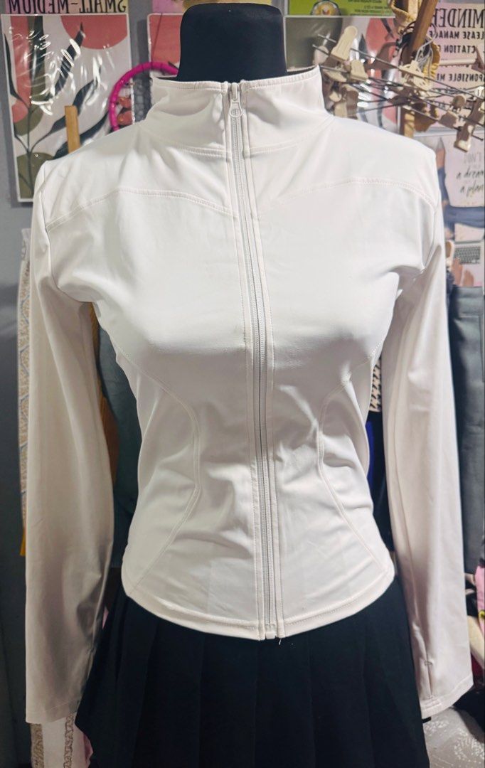 White Full Zip Athletic Jacket with Thumbholes (Category: Coats, Jackets and Outerwear) located in Manila. Submitted by sheinevida (Listing ID 1467265756, Image 1). Description: may mga stains hence selling low size medium to large pinangakyat ng bundok wearable pa din naman needs intensive wash po - Color: White - Style: Fitted athletic zip-up jacket with high collar and curved seam details - Features: Full front zipper and convenient thumbholes