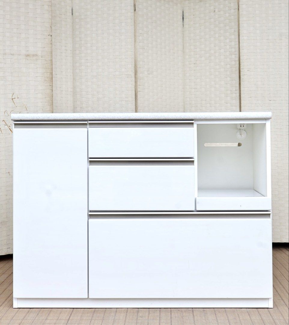 White Kitchen Island Cabinet Storage Unit with Drawers (Category: Shelves, Cabinets & Racks) located in Bulacan. Submitted by FurnitureGallery (Listing ID 1467307787, Image 1). Description: - White kitchen storage cabinet with elegant marble-look countertop - Features 3 smooth-glide drawers and a lower cabinet section - Handy open shelf space with a built-in electrical outlet for appliances - Sturdy, solid structure with a clean minimalist design