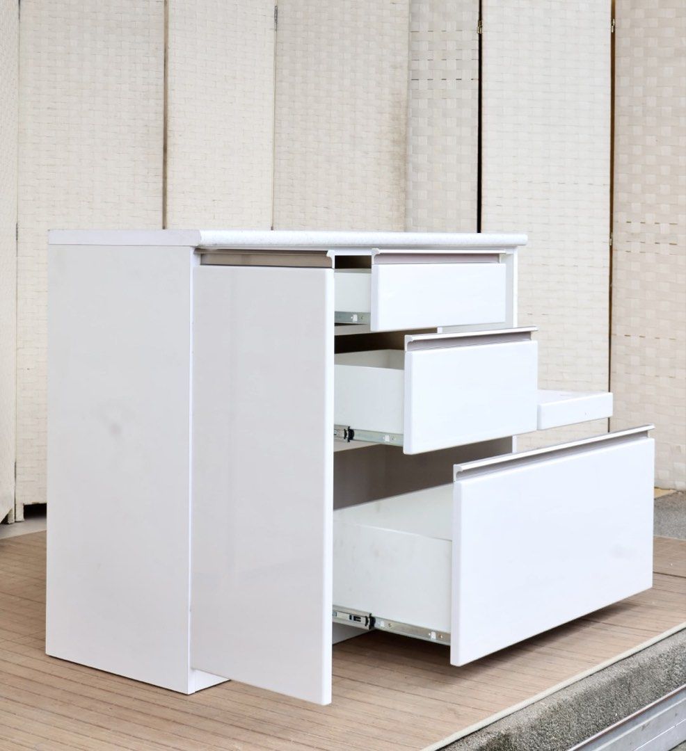 White Kitchen Island Cabinet Storage Unit with Drawers (Category: Shelves, Cabinets & Racks) located in Bulacan. Submitted by FurnitureGallery (Listing ID 1467307787, Image 3). Description: - White kitchen storage cabinet with elegant marble-look countertop - Features 3 smooth-glide drawers and a lower cabinet section - Handy open shelf space with a built-in electrical outlet for appliances - Sturdy, solid structure with a clean minimalist design