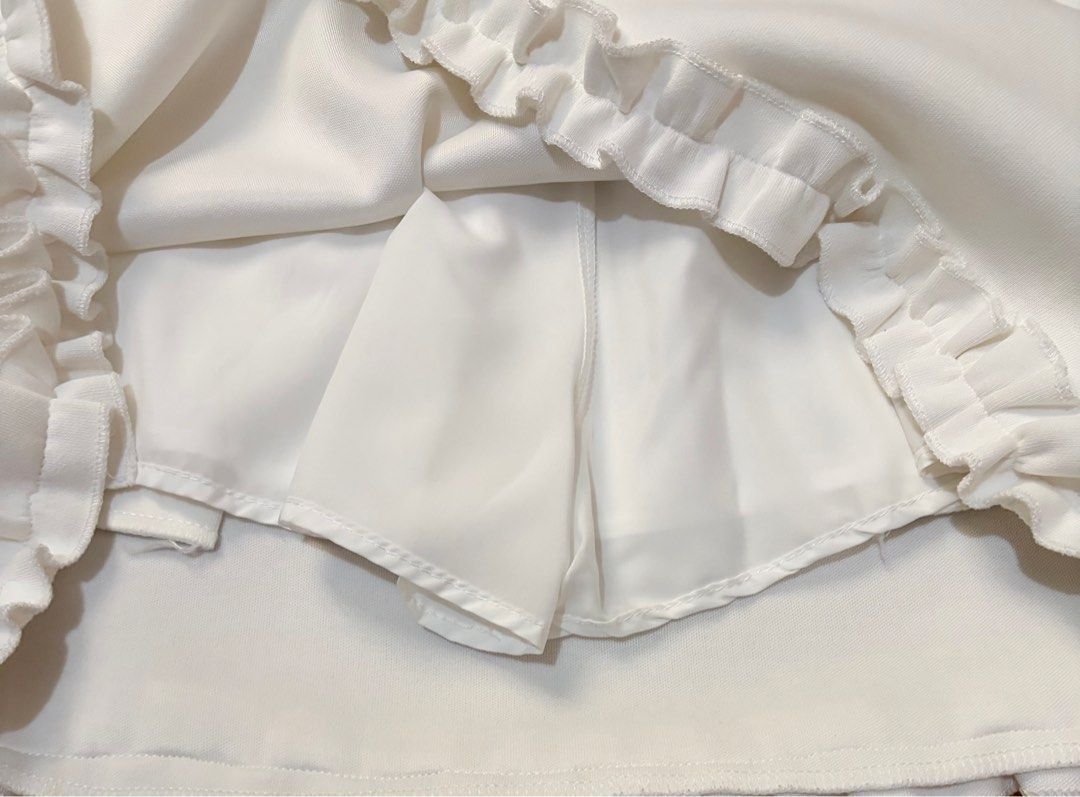 White Mini Skirt with Built-in Shorts Small - Medium (Category: Skirts) located in Quezon City. Submitted by garagesale2026 (Listing ID 1467356373, Image 3). Description: - Never used, No more tag, Washed - With ruffles detailing - Length: 15.5"; Waist: 23-28".