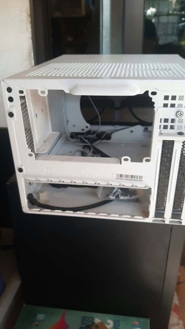 White Mini-ITX PC Computer Case (Category: Desktops) located in Caloocan City. Submitted by mx5a86 (Listing ID 1467180392, Image 2). Description: - Color: Clean minimalist white - Design: Compact mini-ITX/small form factor size - Ventilation: Mesh panels on top and side for maximum airflow - Layout: Includes rear I/O cutout and expansion slots - Management: Comes with internal wiring harness ready for your build.