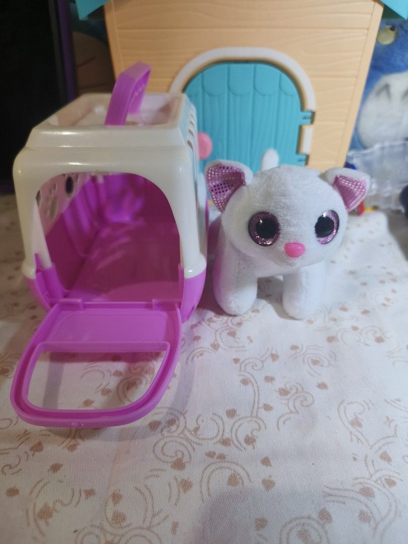 White plush cat toy with pink carrier (Category: Shoulder Bags) located in Caloocan City. Submitted by mckysprelove (Listing ID 1467232137, Image 2). Description: - Adorable white stuffed kitty plush - Features sparkly pink eyes and glittery inner ears - Includes a miniature pink and white plastic pet carrier cage - Compact size makes it great for travel play - Clean fabric and fully functional carrier latch - Perfect addition to any toy animal c