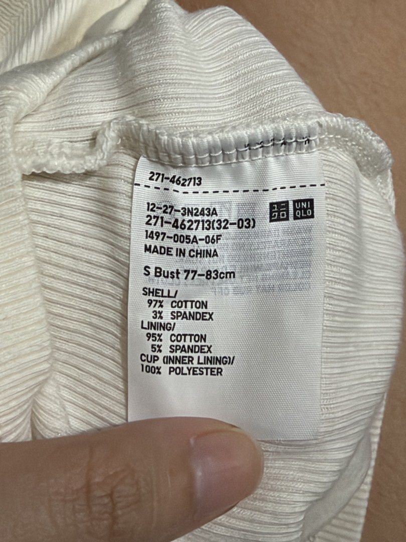 White ribbed tank top crop top (Category: Sleeveless) located in Manila. Submitted by karely (Listing ID 1467241968, Image 2). Description: - Color: White - Style: Ribbed cropped tank top with crew neckline and sleeveless design - Feature: Built-in padding for extra convenience - Material: Soft and stretchy cotton-blend fabric.