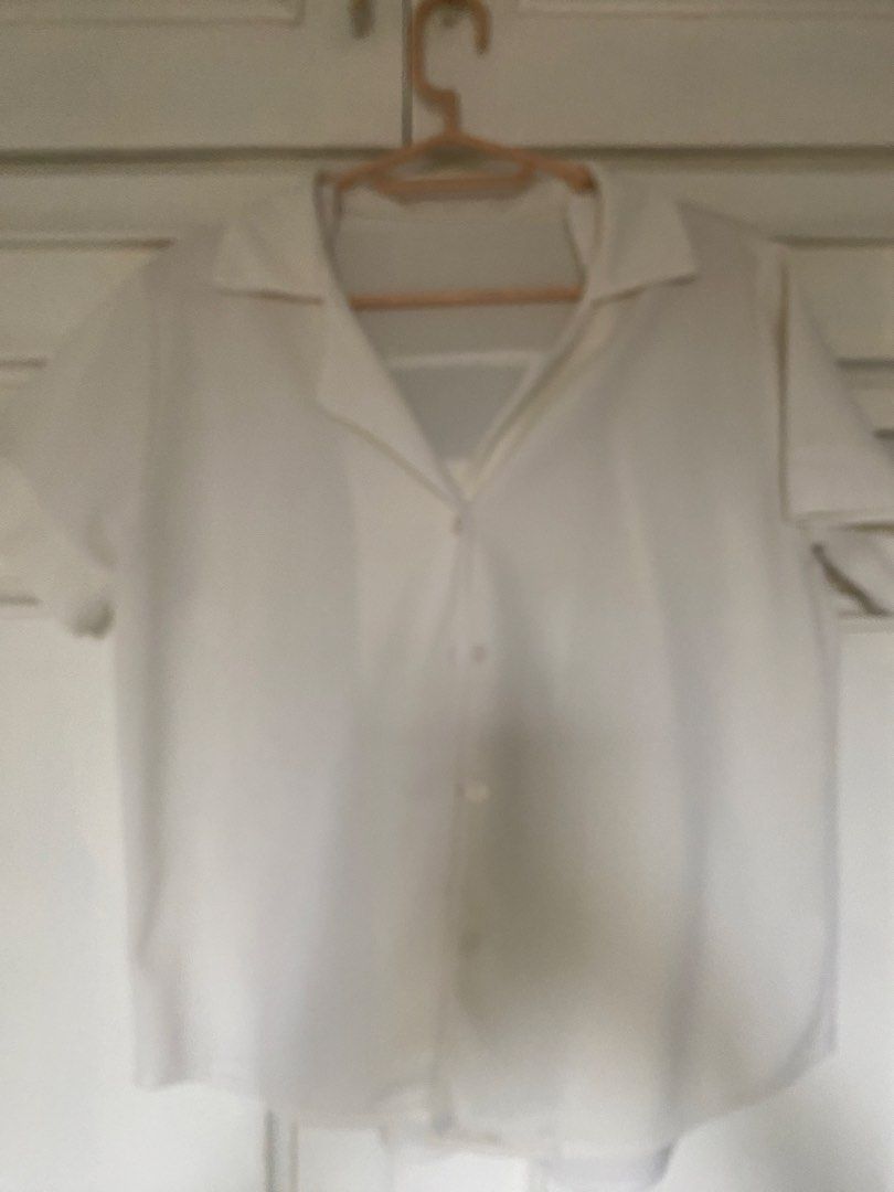 White Short Sleeve Button Down Blouse (Category: Blouses) located in Manila. Submitted by danie_sells (Listing ID 1467278185, Image 2). Description: - Brand: LMM Originals - Color: Classic White - Style: Short sleeve button-down with lapel collar - Material: Lightweight textured fabric - Size: Freesize (fits Small to Large frames) - Condition: Brand new - Perfect basic top for school, office, or casual daily outfits ——— PAYO. Pay As You Order. 💵