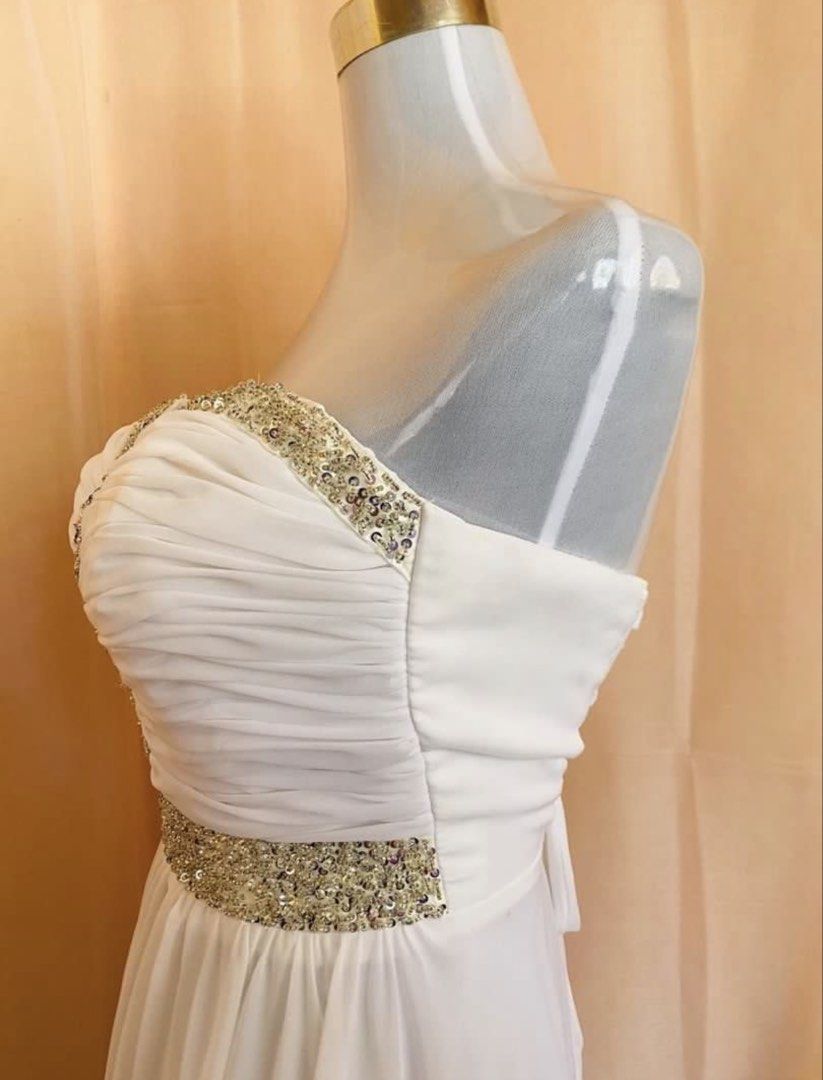 White Strapless Chiffon Evening Gown with Sequin Embellishments (Category: Evening dresses & gowns) located in Marikina City. Submitted by jessylady10 (Listing ID 1467282923, Image 2). Description: Gorgeous white long evening dress featuring a sweetheart strapless neckline, sparkly sequin trim, and a ruched bodice with a pleated chiffon maxi skirt. Includes an adjustable lace-up ribbon tie back for the perfect fit. Ideal for formal events and par