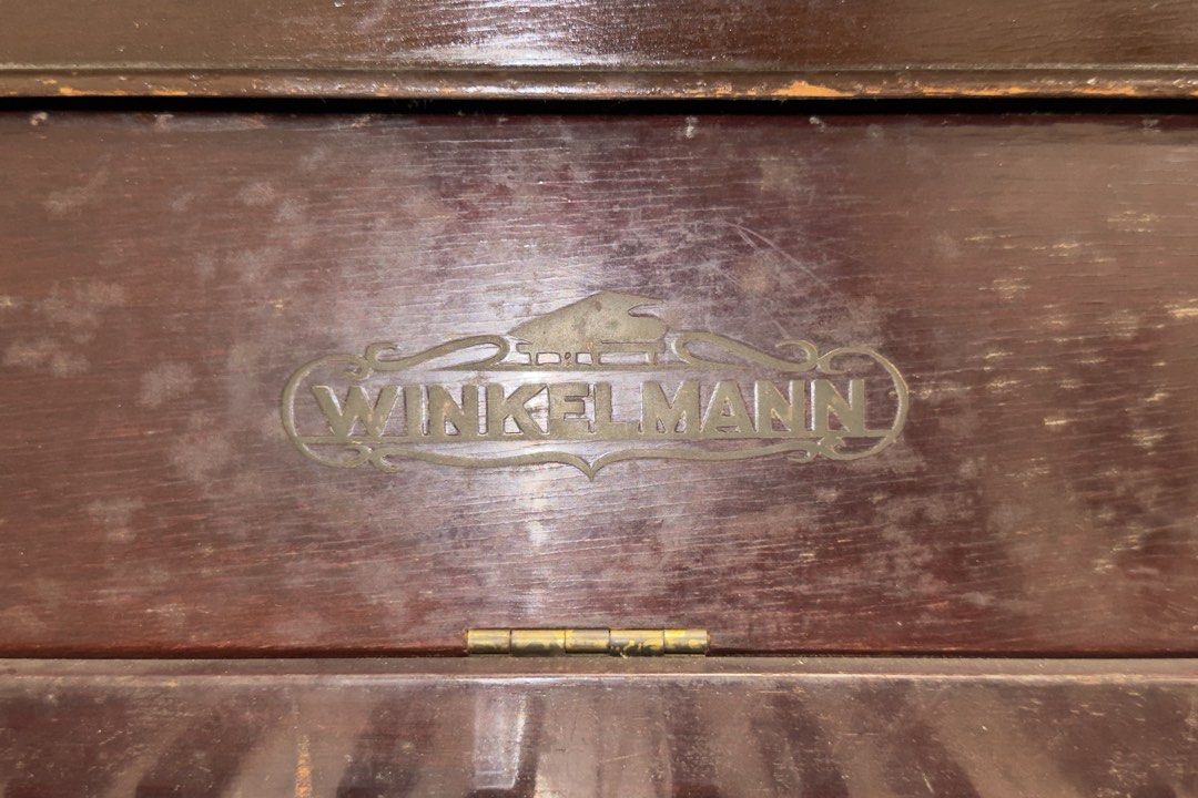 Winkelmann Upright Piano with Bench (Category: Musical Instruments) located in Manila. Submitted by snorluxxx24 (Listing ID 1467298529, Image 2). Description: RUSH SALE‼️ Authentic German vintage upright piano with matching upholstered bench. Great restoration project or classic home decor/display piece. Details & Issues: • Brand: Zeitter & Winkelmann (German) • Condition: Needs tuning and basic maintenance • Flaws: Missing 1 key and broken middl