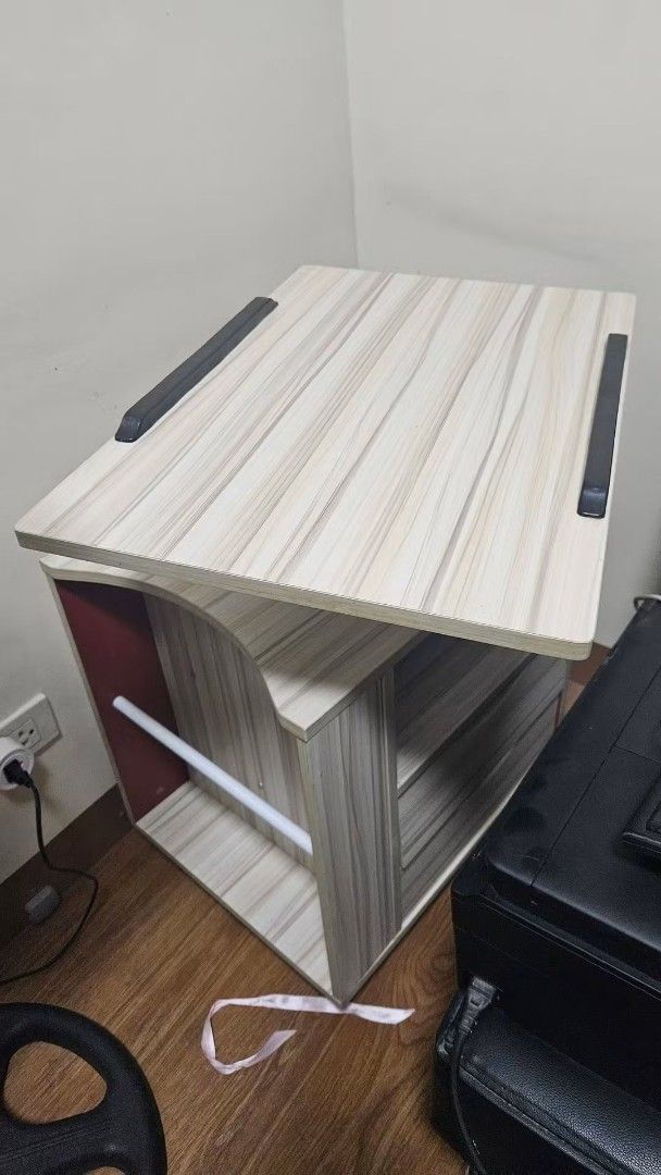 Wood Grain Rolling Computer Cart Desk Printer Stand (Category: Office Furniture & Fixtures) located in Manila. Submitted by boldlion.613922 (Listing ID 1467193909, Image 2). Description: - Multi-tier mobile desk stand with a sleek wood grain finish - Top shelf ideal for monitors or laptops - Middle shelf designed for quick-access accessories - Lower storage area keeps paperwork and small equipment organized - Equipped with smooth-rolling caster w