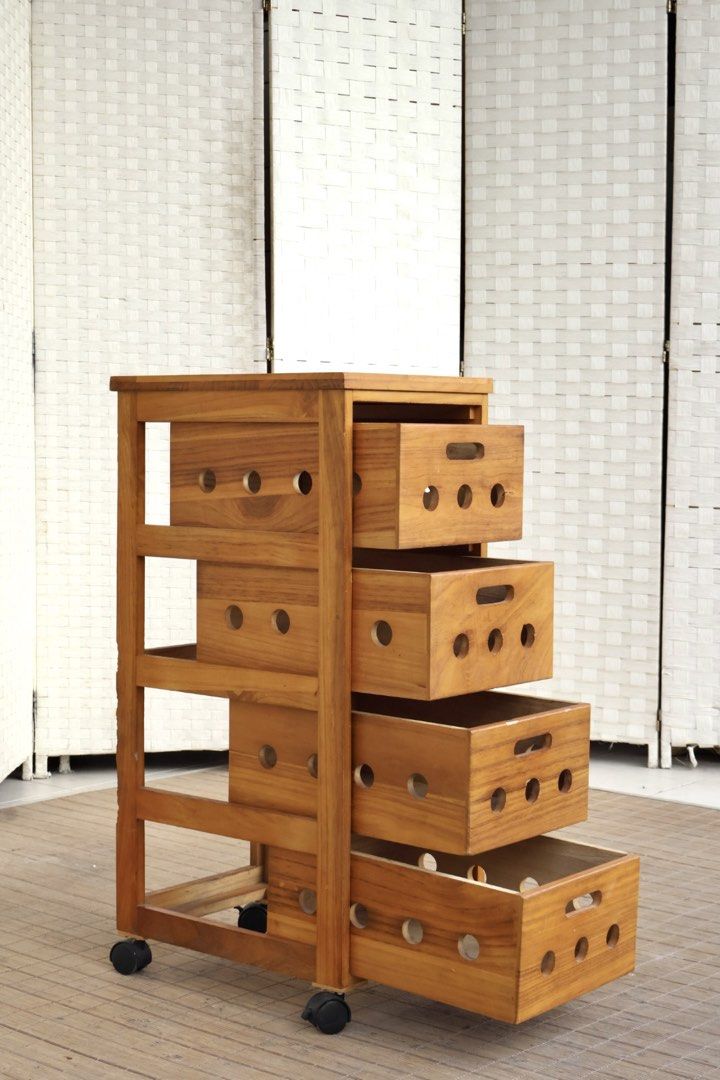 Wooden 4-Drawer Rolling Storage Cabinet (Category: Shelves, Cabinets & Racks) located in Bulacan. Submitted by FurnitureGallery (Listing ID 1467304295, Image 3). Description: - 4 roomy drawers with easy-grip handle slots - Built-in ventilation cutouts on the front and sides - Smooth-rolling black caster wheels for easy mobility - Stylish natural wood grain finish - Solid and sturdy construction - Versatile design fits study, kitchen, or living ro