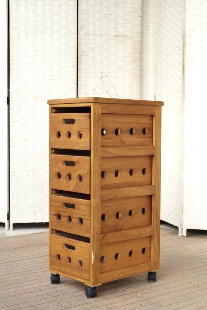 Wooden 4-Drawer Rolling Storage Cabinet (Category: Shelves, Cabinets & Racks) located in Bulacan. Submitted by FurnitureGallery (Listing ID 1467304295, Image 2). Description: - 4 roomy drawers with easy-grip handle slots - Built-in ventilation cutouts on the front and sides - Smooth-rolling black caster wheels for easy mobility - Stylish natural wood grain finish - Solid and sturdy construction - Versatile design fits study, kitchen, or living ro