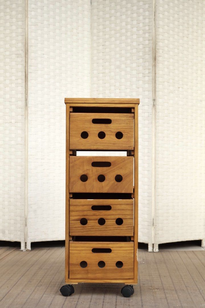 Wooden 4-Drawer Rolling Storage Cabinet (Category: Shelves, Cabinets & Racks) located in Bulacan. Submitted by FurnitureGallery (Listing ID 1467304295, Image 1). Description: - 4 roomy drawers with easy-grip handle slots - Built-in ventilation cutouts on the front and sides - Smooth-rolling black caster wheels for easy mobility - Stylish natural wood grain finish - Solid and sturdy construction - Versatile design fits study, kitchen, or living ro