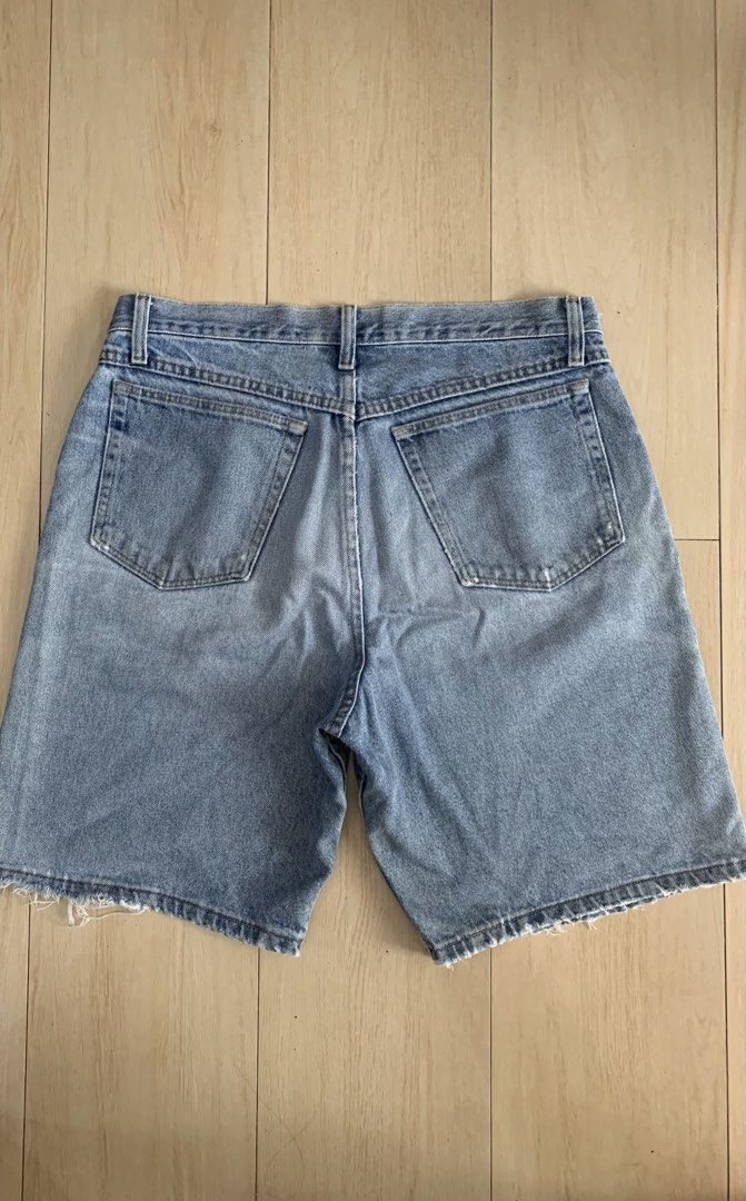 Wrangler Denim distressed shorts (Category: Shorts) located in Manila. Submitted by thrifty111 (Listing ID 1467177748, Image 2). Description: - Fit: Relaxed fit, heavyweight 100% cotton - Color/Wash: Light wash denim - Details: Distressed fraying hems, small rip on left leg - Features: Classic 5-pocket design, button fly closure - size 34-35 - Length 21” - leg opening 12”.