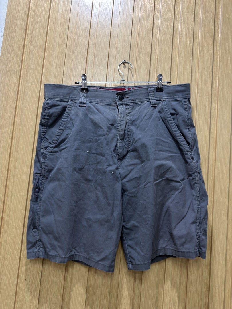 Wrangler Grey Cargo Shorts Size 32 (Category: Shorts) located in Bacoor. Submitted by preloved_with_love_ (Listing ID 1467255765, Image 1). Description: - Brand: Wrangler - Color: Grey - Size: Waist 32 - Closure: Standard button and zipper fly - Pockets: Multiple utility pockets, including a secure zip side pocket and back welt pockets - Details: Stylish red branded interior waistband lining and signature tree logo back belt loop patch.