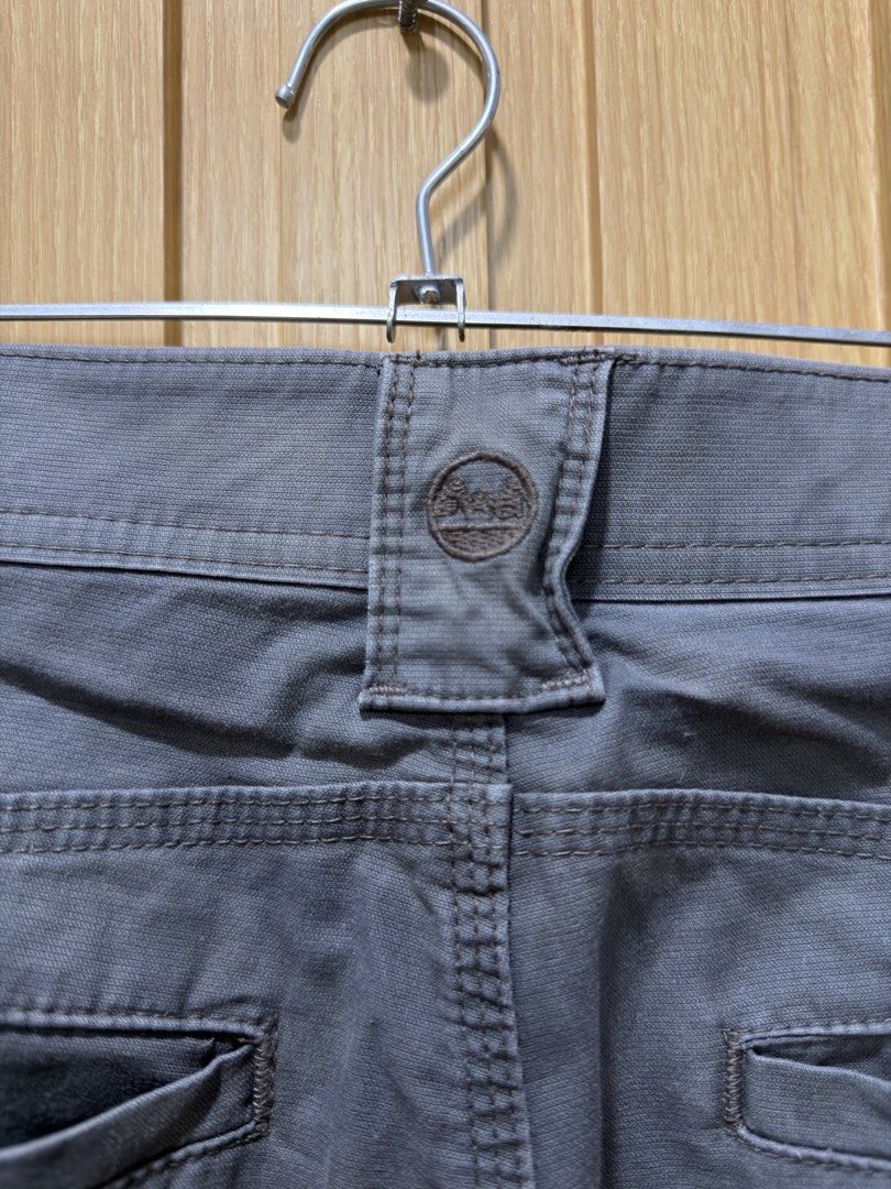 Wrangler Grey Cargo Shorts Size 32 (Category: Shorts) located in Bacoor. Submitted by preloved_with_love_ (Listing ID 1467255765, Image 3). Description: - Brand: Wrangler - Color: Grey - Size: Waist 32 - Closure: Standard button and zipper fly - Pockets: Multiple utility pockets, including a secure zip side pocket and back welt pockets - Details: Stylish red branded interior waistband lining and signature tree logo back belt loop patch.