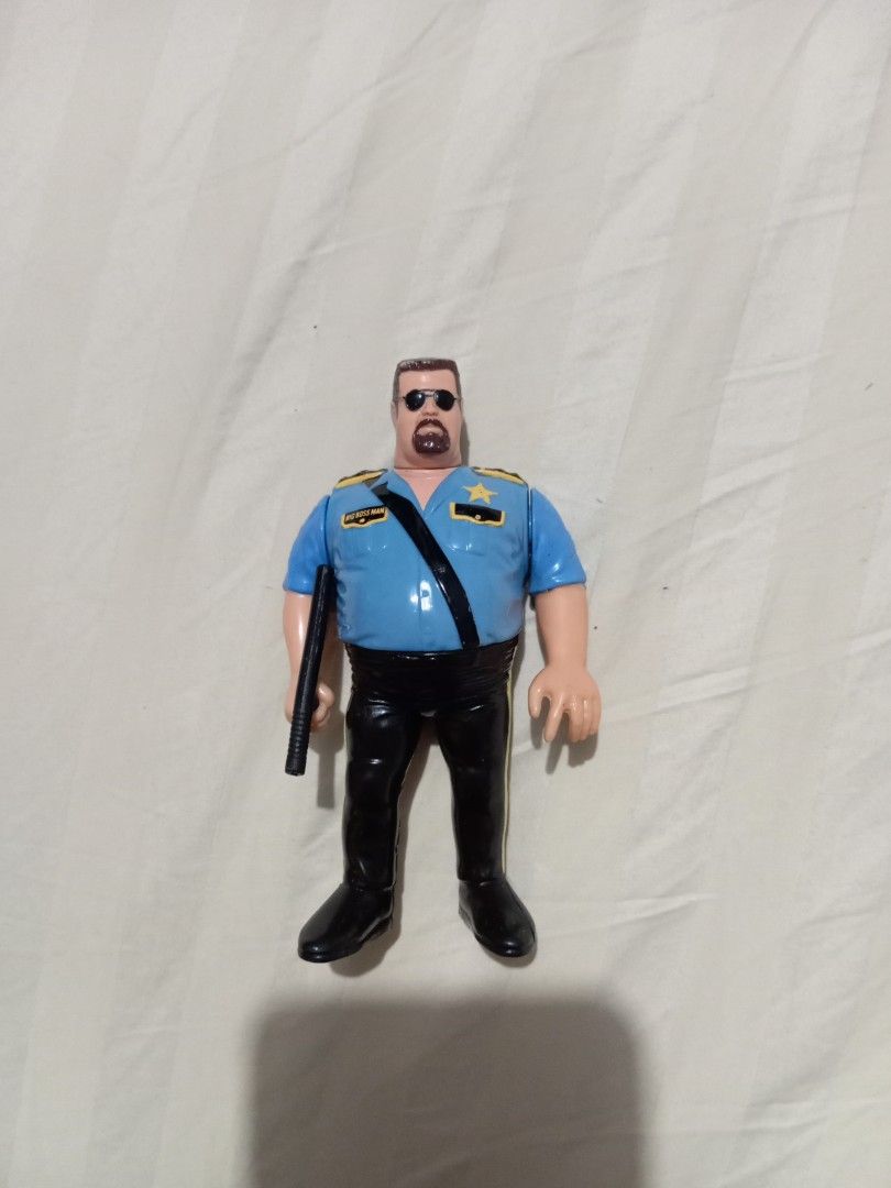 WWF Hasbro Big Boss Man Action Figure (Category: Action & Battle Toys) located in Manila. Submitted by johnhunte48138 (Listing ID 1467219181, Image 3). Description: - Vintage Hasbro WWF Big Boss Man wrestling action figure - Wears classic blue police uniform shirt, black pants, and sunglasses - Includes original black nightstick accessory - Authentic 90s collectible toy for wrestling fans.