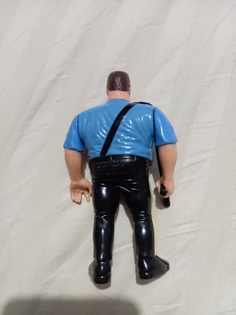WWF Hasbro Big Boss Man Action Figure (Category: Action & Battle Toys) located in Manila. Submitted by johnhunte48138 (Listing ID 1467219181, Image 2). Description: - Vintage Hasbro WWF Big Boss Man wrestling action figure - Wears classic blue police uniform shirt, black pants, and sunglasses - Includes original black nightstick accessory - Authentic 90s collectible toy for wrestling fans.