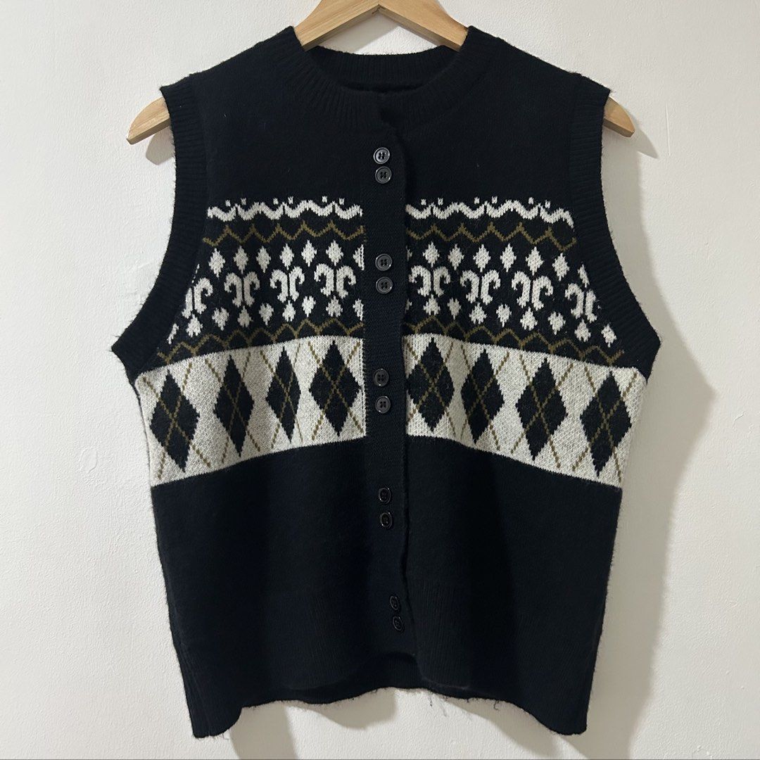 [XL] Black Patterned Button-Up Knitwear Sweater Vest (Category: Sleeveless) located in Tanza. Submitted by shop_qrated (Listing ID 1467260902, Image 2). Description: Black Patterned Button-Up Knitwear Sweater Vest. XL. Ganda but not my size so I am selling. This item appears to be a black button-up knit sweater vest featuring a white and gray argyle pattern across the chest and a Nordic-style geometric yoke detailing near the ribbed crew neckline