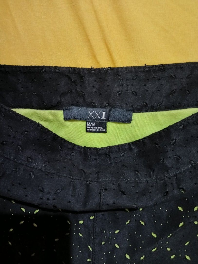 XXI Black Eyelet Shorts (Category: Shorts) located in Lingayen. Submitted by mixxvarietycollections (Listing ID 1467313722, Image 3). Description: - Brand: Forever 21 - Size: M(tape measure: 30) - Color: Black with neon green inner lining - Design: Eyelet cut-out pattern - Ideal for warm weather and casual days - Easy to mix and match with various tops - side zipper.
