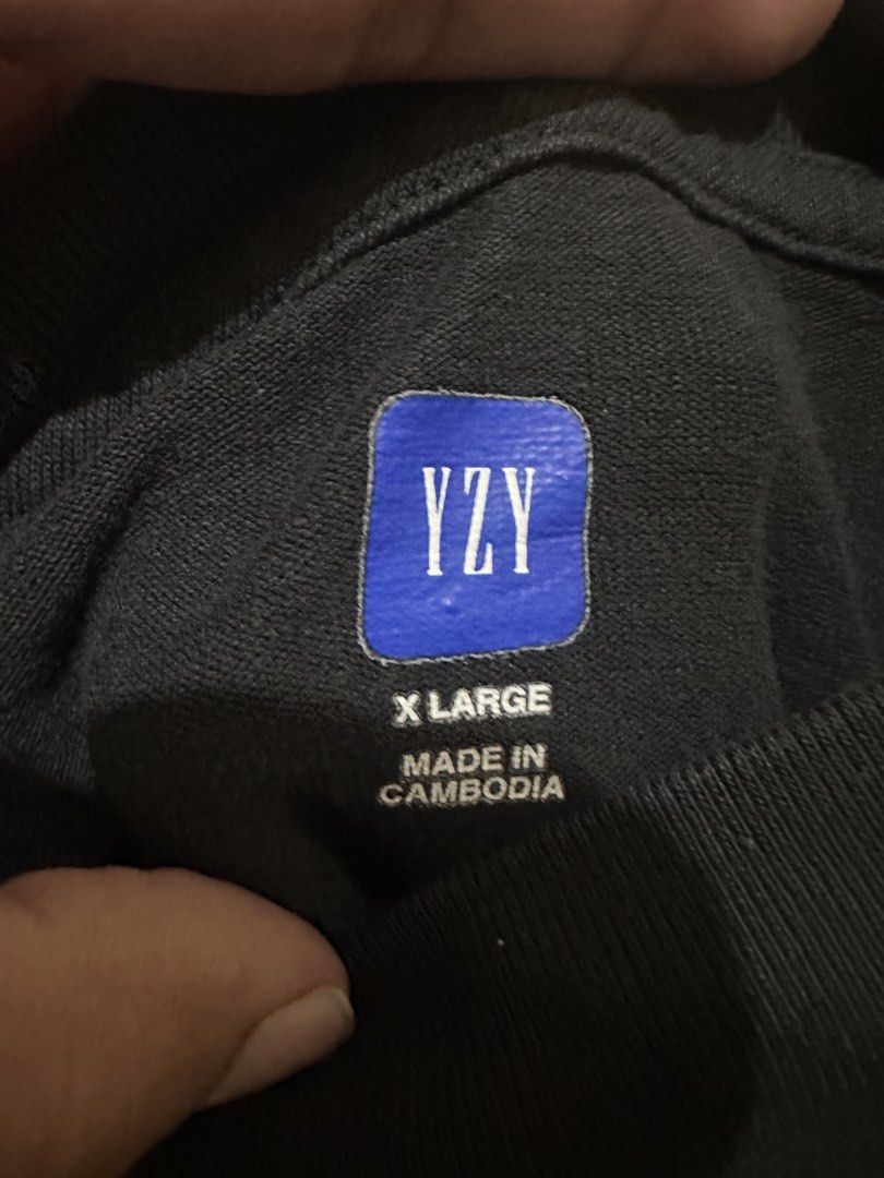Yeezy Gap Engineered by Balenciaga Dove Tee Black (Category: Tshirts & Polo Shirts ) located in Tagum. Submitted by ritarits572 (Listing ID 1467290709, Image 3). Description: - Brand: Yeezy Gap Engineered by Balenciaga - Item: Dove Tee - Color: Washed Black - Size: XL, 24 x 29 - Fit: Oversized boxy silhouette with mock neck - Details: Tonal GAP chest logo and distressed white dove back graphic - Material: Heavyweight cotton - Origin: Made in Camb