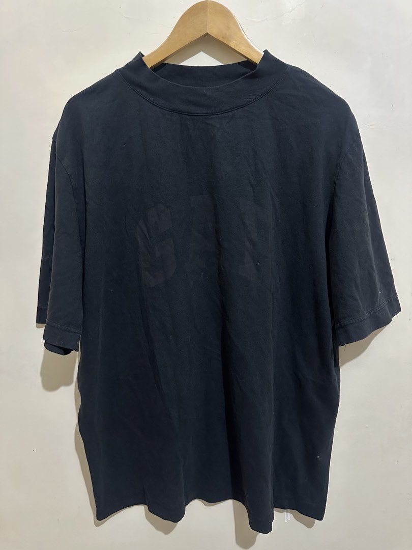 Yeezy Gap Engineered by Balenciaga Dove Tee Black (Category: Tshirts & Polo Shirts ) located in Tagum. Submitted by ritarits572 (Listing ID 1467290709, Image 2). Description: - Brand: Yeezy Gap Engineered by Balenciaga - Item: Dove Tee - Color: Washed Black - Size: XL, 24 x 29 - Fit: Oversized boxy silhouette with mock neck - Details: Tonal GAP chest logo and distressed white dove back graphic - Material: Heavyweight cotton - Origin: Made in Camb
