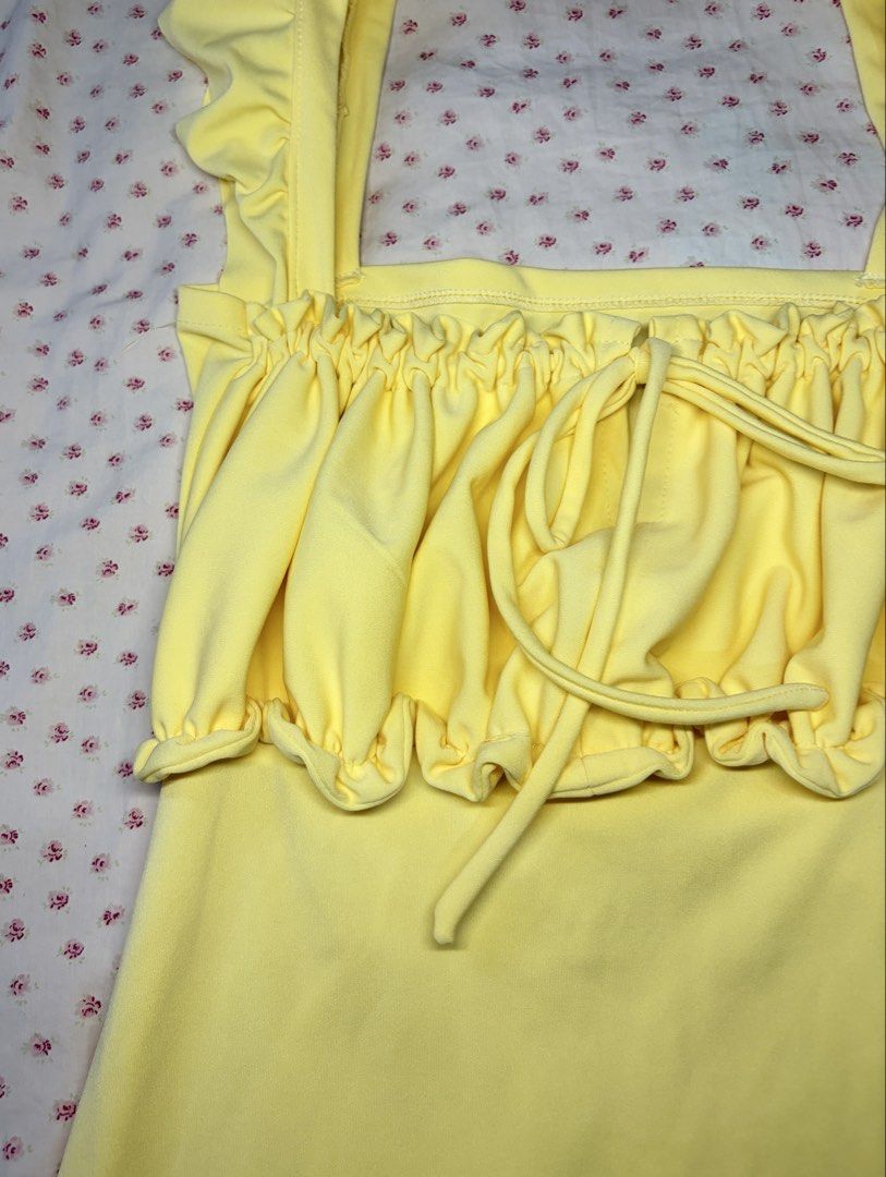 Yellow Ruffle Straps Dress Ruched Bust Drawstring (Category: Dresses) located in Taguig. Submitted by riri_aofe (Listing ID 1467229823, Image 3). Description: - Color: Light Pastel/Butter Yellow - Style: Summer mini dress - Fabric: Buttery soft, super comfortable & stretchy - Neckline & Straps: Square neckline with ruffled shoulder straps - Bust: Ruched bust with adjustable front drawstring - Waist: Matching waist tie that loops around the sides 