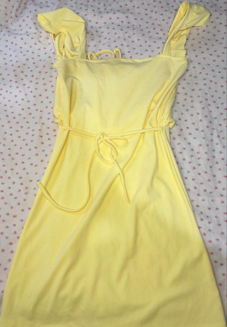 Yellow Ruffle Straps Dress Ruched Bust Drawstring (Category: Dresses) located in Taguig. Submitted by riri_aofe (Listing ID 1467229823, Image 2). Description: - Color: Light Pastel/Butter Yellow - Style: Summer mini dress - Fabric: Buttery soft, super comfortable & stretchy - Neckline & Straps: Square neckline with ruffled shoulder straps - Bust: Ruched bust with adjustable front drawstring - Waist: Matching waist tie that loops around the sides 