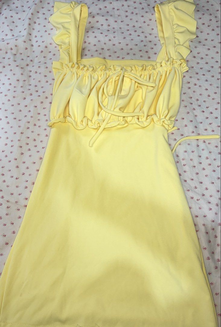 Yellow Ruffle Straps Dress Ruched Bust Drawstring (Category: Dresses) located in Taguig. Submitted by riri_aofe (Listing ID 1467229823, Image 1). Description: - Color: Light Pastel/Butter Yellow - Style: Summer mini dress - Fabric: Buttery soft, super comfortable & stretchy - Neckline & Straps: Square neckline with ruffled shoulder straps - Bust: Ruched bust with adjustable front drawstring - Waist: Matching waist tie that loops around the sides 