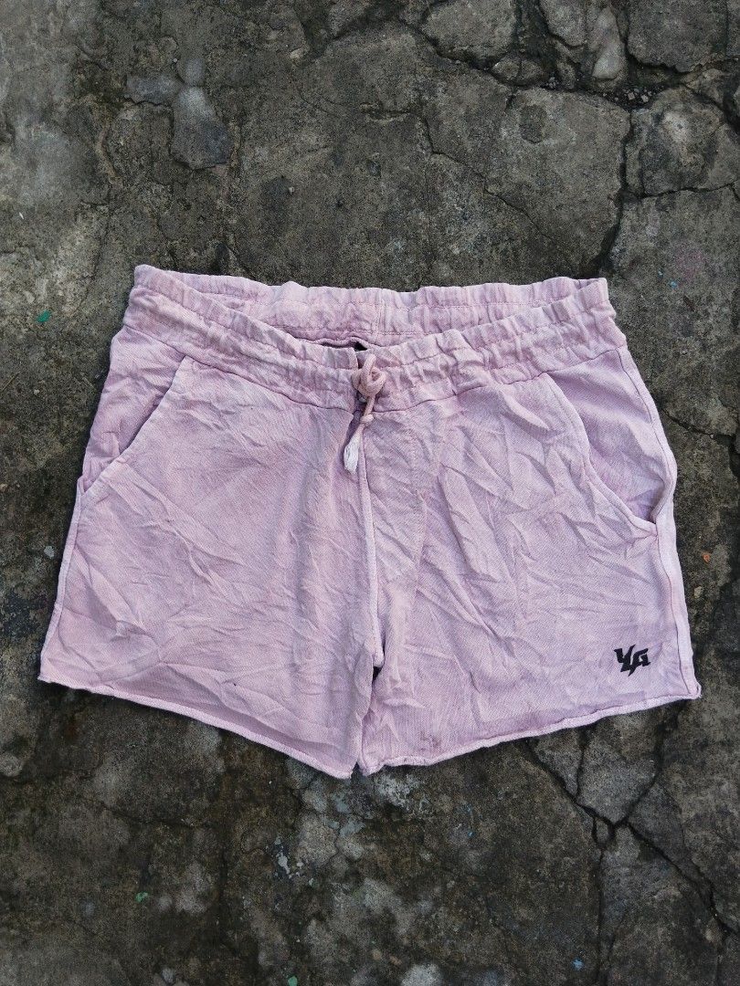 YoungLA Pink Cotton Drawstring Shorts Size L (Category: Shorts) located in Tabaco. Submitted by skycat_29 (Listing ID 1467173660, Image 1). Description: - Brand: YoungLA - Color: Pink - Size: Large (L) - Material: 100% Cotton - Fit: Relaxed fit, great for casual wear or lounging - Features: Elastic waistband with drawstring closure - Pockets: Side pockets and one back pocket with branded label - Hem: Raw hem finish at the bottom.