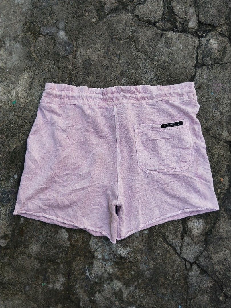 YoungLA Pink Cotton Drawstring Shorts Size L (Category: Shorts) located in Tabaco. Submitted by skycat_29 (Listing ID 1467173660, Image 3). Description: - Brand: YoungLA - Color: Pink - Size: Large (L) - Material: 100% Cotton - Fit: Relaxed fit, great for casual wear or lounging - Features: Elastic waistband with drawstring closure - Pockets: Side pockets and one back pocket with branded label - Hem: Raw hem finish at the bottom.