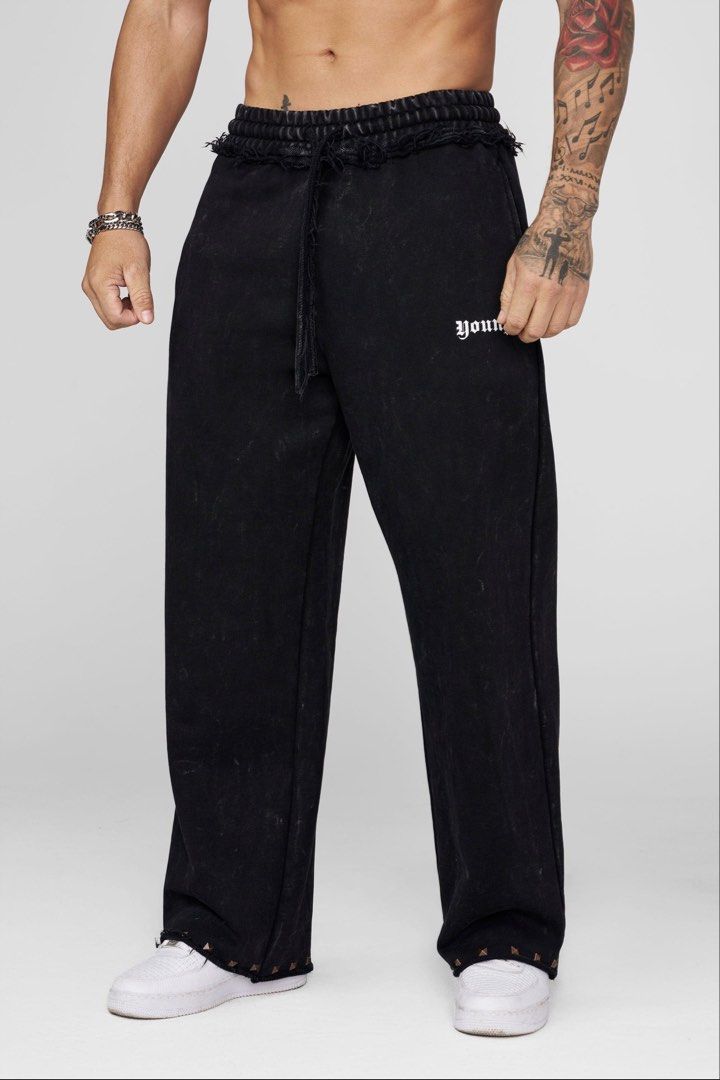 YOUNGLA Stud Sweats (Category: Activewear) located in Bayombong. Submitted by rethreadsactivewear (Listing ID 1467179496, Image 1). Description: ON-HAND! READY TO SHIP! 🔥 YOUNGLA Stud Sweats Black Washed Medium Like new 3100 only! Product Description MATERIAL: 100% Cotton French Terry FABRIC WEIGHT: 600 GSM FIT: Baggy DESIGN: A heavyweight French terry sweatpant built with a clean, relaxed silhouette and elevated detailing. The mineral wash give