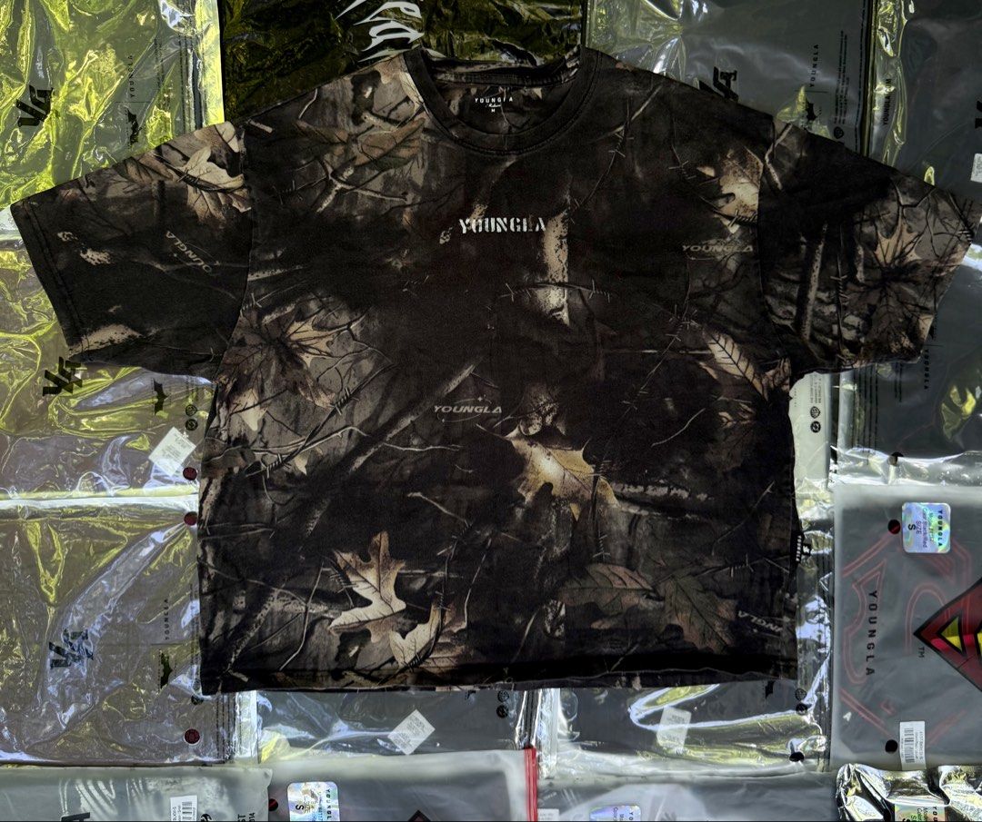 YOUNGLA Tree Camou Collection Tee (Category: Activewear) located in Bayombong. Submitted by rethreadsactivewear (Listing ID 1467178934, Image 2). Description: ON-HAND! READY TO SHIP! YOUNGLA Tree Camou Collection Shirt Medium Like new condition 1749 only! Product Details Material: 100% Cotton Fabric Weight: 290 GSM (heavyweight terry construction) Fit: Loose / Oversized Design & Feel: The Tree Camo Tee takes everyday wear to the next level. Cut f