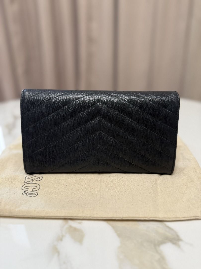 YSL Black Wallet (Category: Luxury Bags & Wallets) located in Marikina City. Submitted by tashdeclutters. (Listing ID 1467315447, Image 2). Description: ✨ YSL Black Wallet - P34,990 ✨ Condition: 3 - Good/Lightly Used 🛍️ Purchased in: Japan 📝 Note: zipper pull had to be replaced locally, please see photos. Buyers have the option to replace this via other bag spas. ✨ @tashdeclutters ✨ Created to share the things that no longer spark joy with Tash