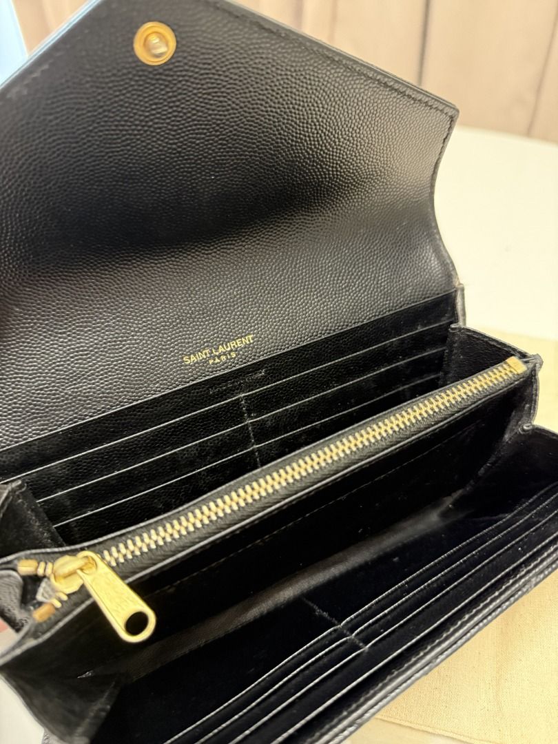 YSL Black Wallet (Category: Luxury Bags & Wallets) located in Marikina City. Submitted by tashdeclutters. (Listing ID 1467315447, Image 3). Description: ✨ YSL Black Wallet - P34,990 ✨ Condition: 3 - Good/Lightly Used 🛍️ Purchased in: Japan 📝 Note: zipper pull had to be replaced locally, please see photos. Buyers have the option to replace this via other bag spas. ✨ @tashdeclutters ✨ Created to share the things that no longer spark joy with Tash