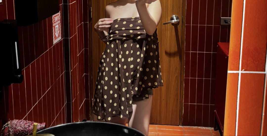Zara Asymmetric Polka Dot Skirt (Category: Skirts) located in Makati City. Submitted by mimi.favell (Listing ID 1467185135, Image 2). Description: - Brand: Zara - Pattern: Brown and yellow polka dot - Design: Unique asymmetric hemline with flowy fabric - Versatility: Can be worn as a skirt or styled as a strapless top - Styling Tip: Matches well with brown or neutral tones. Dm for more inquiries!.
