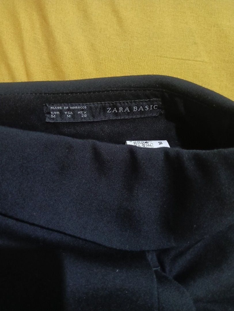 Zara Basic Black Roll-Up Shorts (Category: Shorts) located in Lingayen. Submitted by mixxvarietycollections (Listing ID 1467312429, Image 3). Description: - Brand: Zara Basic - Color: Solid Black - Size: EUR M / USA M / MEX 28 - Size in tape measure: 33 - Rise: Mid-rise waist - Details: Rolled cuffs at the hem, clean finish inside and out - Closure: Standard zip and button closure at the back - Origin: Made in Morocco - Condition: Excellent, vers