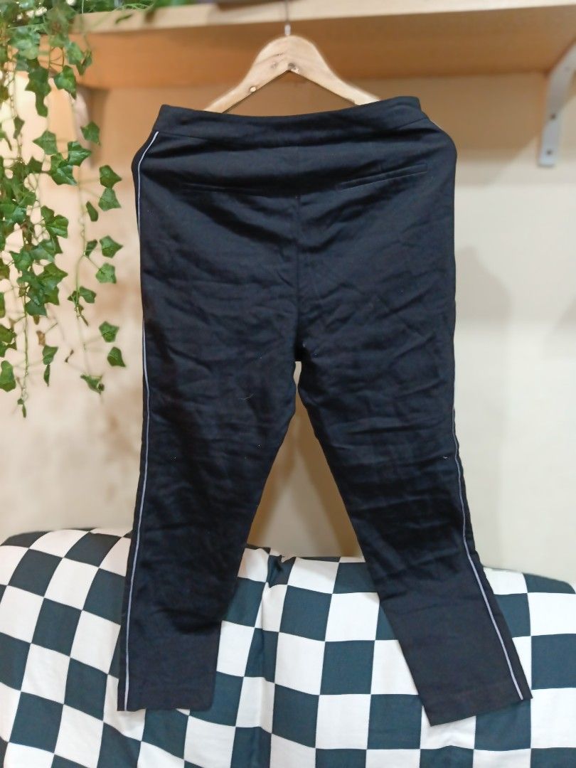 Zara Basic Black Trousers Size L (Category: Jeans) located in Manila. Submitted by cami1914 (Listing ID 1467337477, Image 2). Description: - Brand/Model: Zara Basic - Size: L - Color: Black with thin piping stripe on outer sides - Cut: Standard straight cut - Closure: Side zipper and hook - Origin: Made in Cambodia - Condition: Clean fabric with minimal signs of wear.