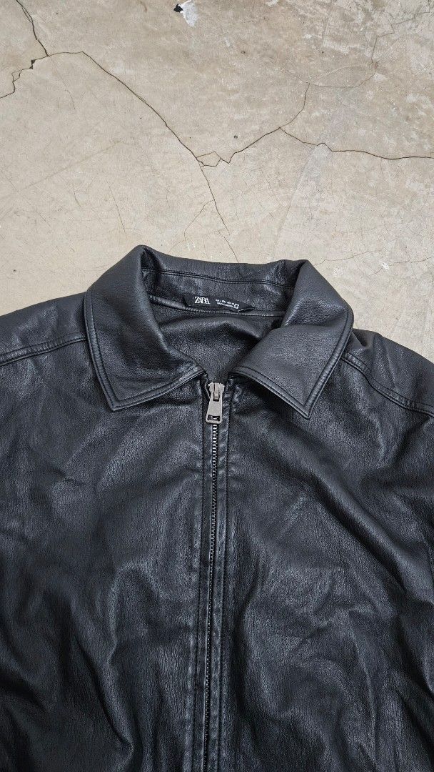 Zara Black Leather Jacket (Category: Coats, Jackets and Outerwear) located in Alfonso. Submitted by jbcamet (Listing ID 1467310836, Image 3). Description: - Brand: Zara - Color: Black - Size: L (True to size) - Material: Quality leather construction with inner lining - Features: Full zip front, classic collar, two side welt pockets, elastic cuffs and hem.