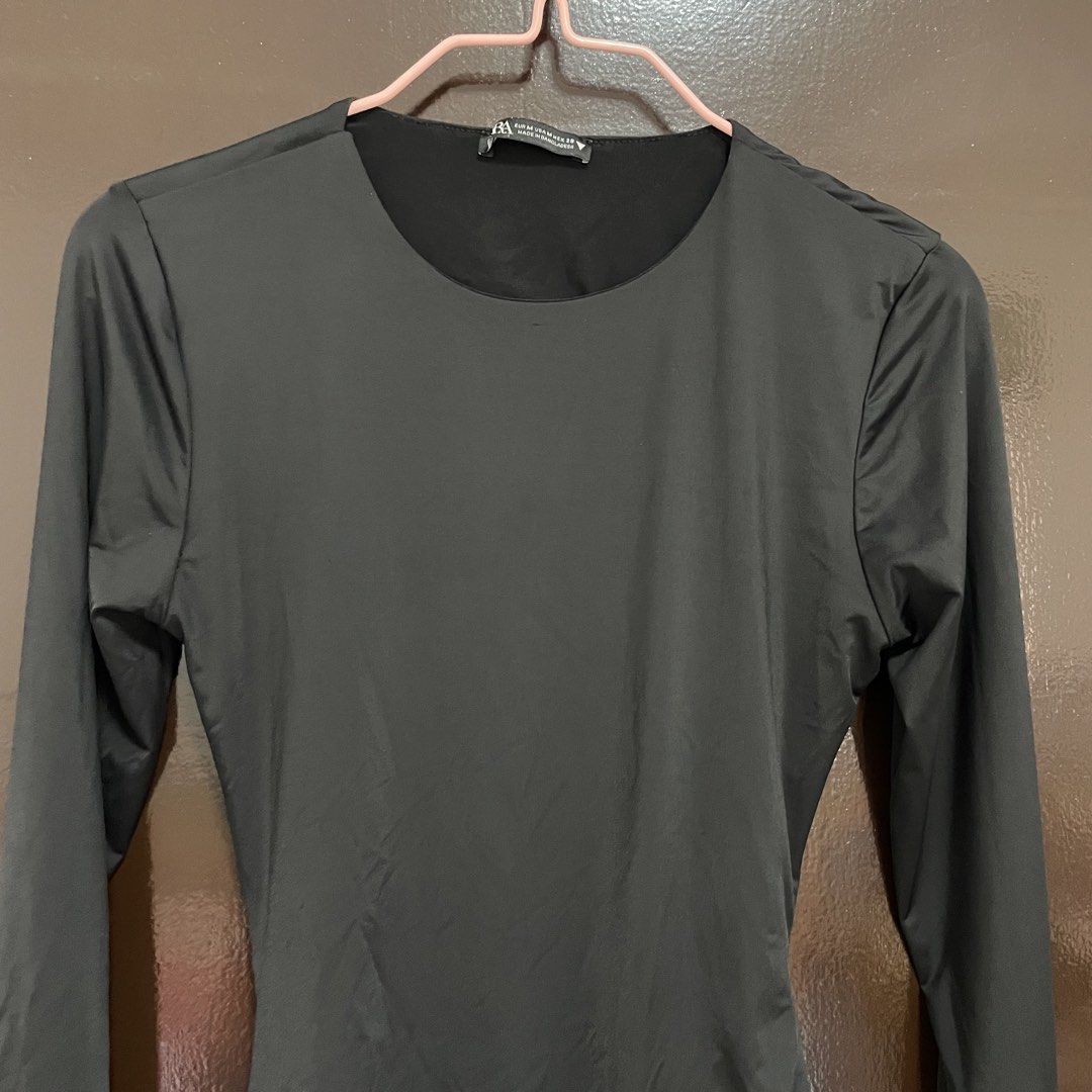 Zara Black Long Sleeve Bodysuit Size M (Category: Longsleeves) located in Pasay City. Submitted by lovedbyzea (Listing ID 1467341006, Image 2). Description: - size M but more on XS - S - Brand: Zara - Style: Long sleeve basic bodysuit with scoop neckline - Size: M (label intact) - Color: Black - Features: Stretch fabric, convenient snap button closure at the bottom - Origin: Made in Bangladesh - Condition: Clean, tags intact, never worn - Great f